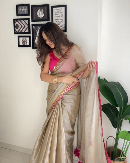 Acclaim the Elegance of Golden Brown Uppada Tissue Silk Saree with Designer Charm