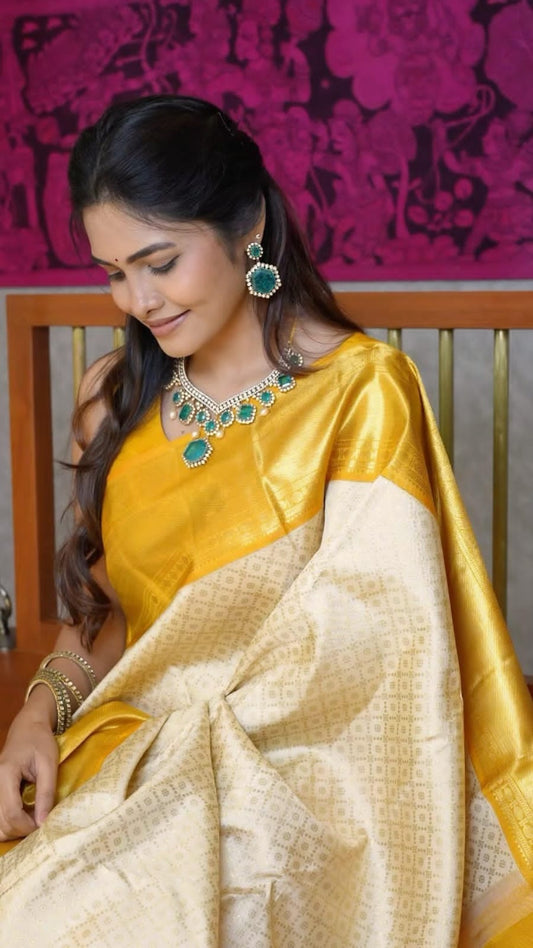 Radiate Elegance in Off White Soft Silk Kanjivaram Saree with Yellow Border