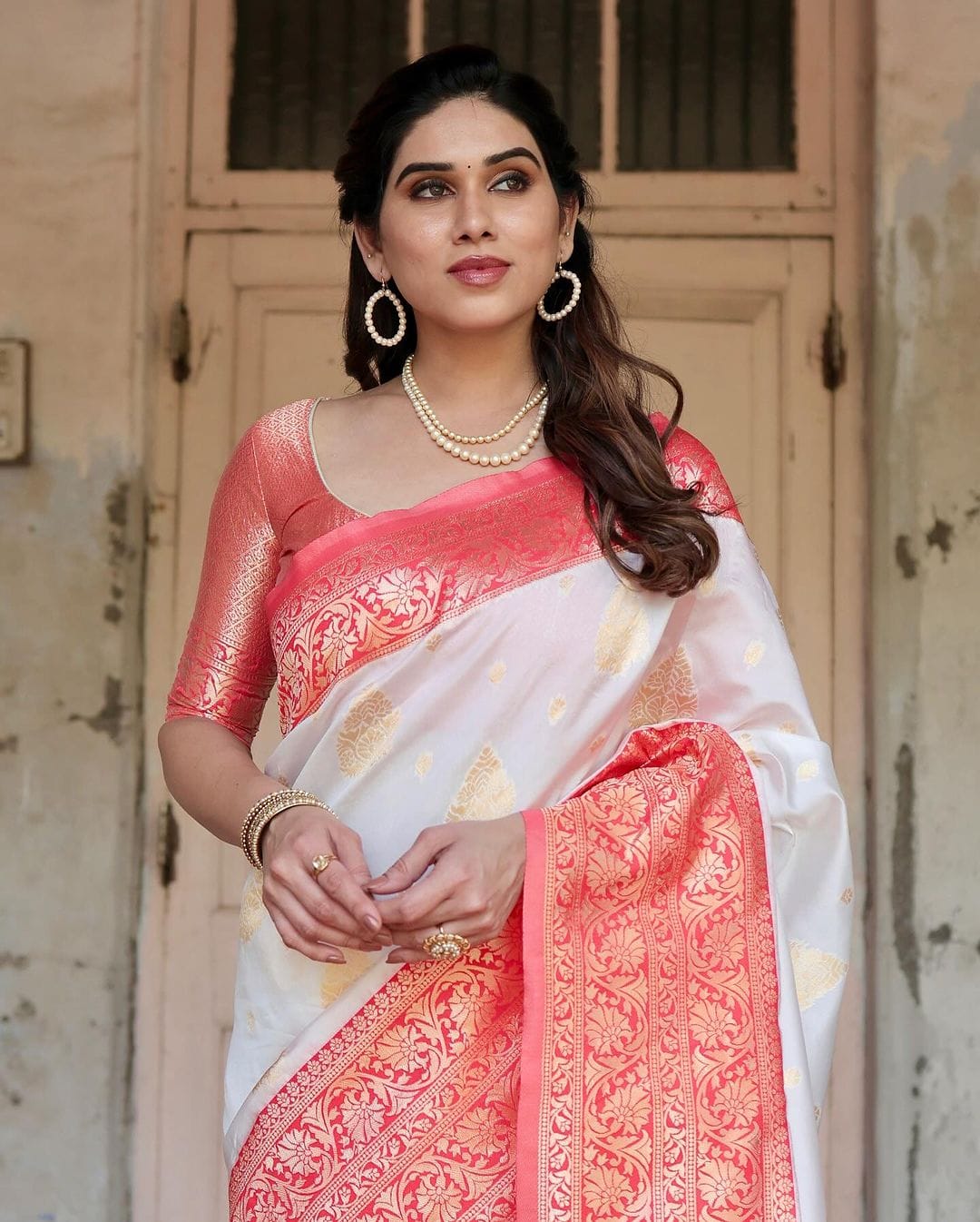 Graceful White Silk Saree Featuring Gold Embroidery and Elegant Coral Pallu