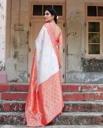 Graceful White Silk Saree Featuring Gold Embroidery and Elegant Coral Pallu