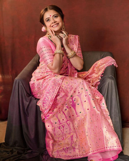 Traditional Beauty: A Woman's Grace in a Vibrant Pink Silk Saree