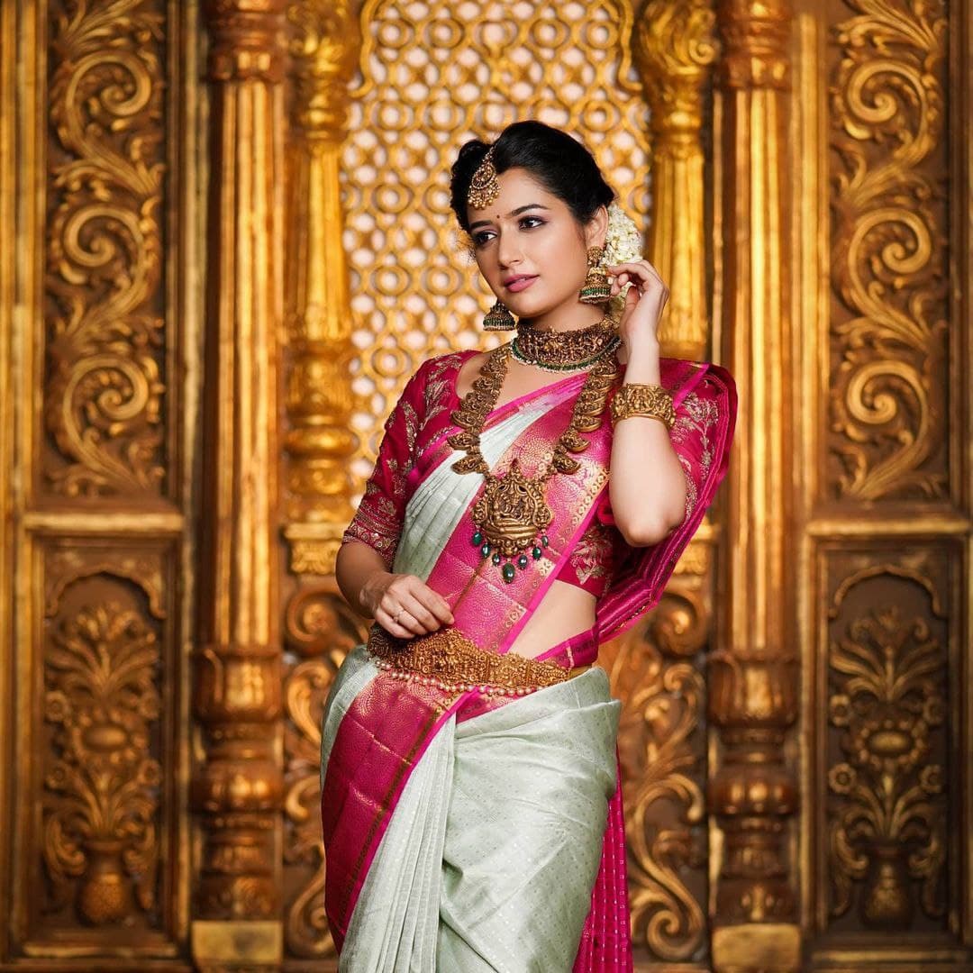 Graceful Charm: Traditional Saree with Vibrant Pink Border and Gold Zari Accents