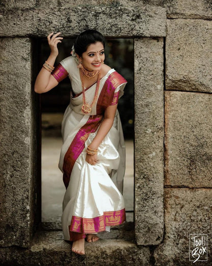 Elegant White Kanjivaram Saree with Contrasting Pink Border