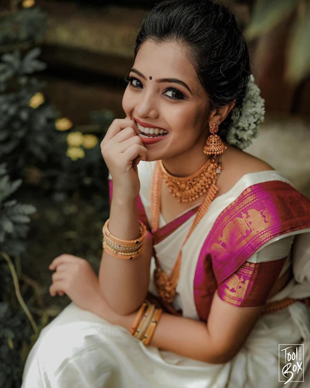 Elegant White Kanjivaram Saree with Contrasting Pink Border