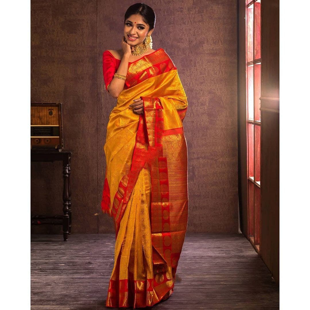 Traditional Indian Beauty: Mustard Yellow Kanjeevaram Saree with Elegant Gold Detailing