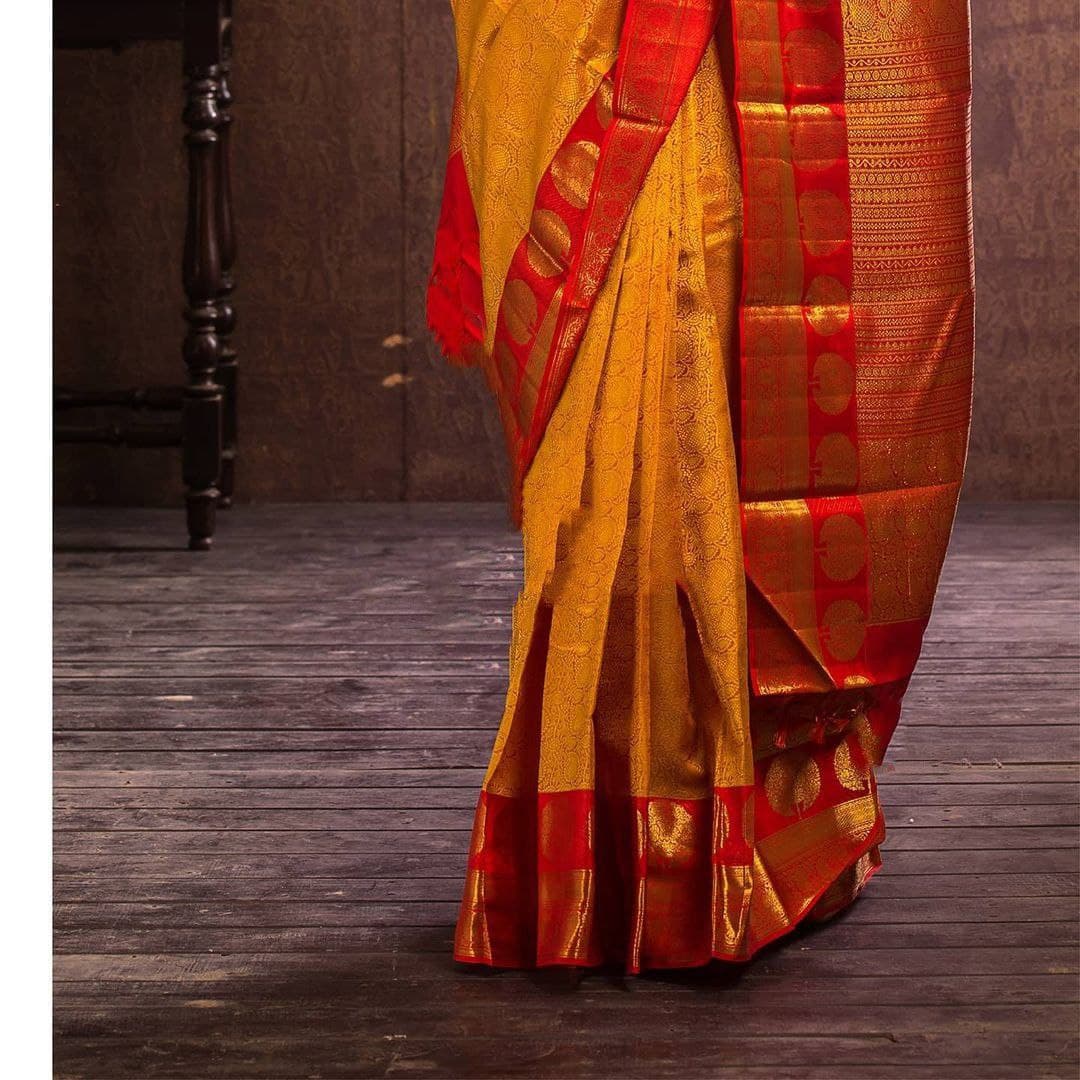 Traditional Indian Beauty: Mustard Yellow Kanjeevaram Saree with Elegant Gold Detailing