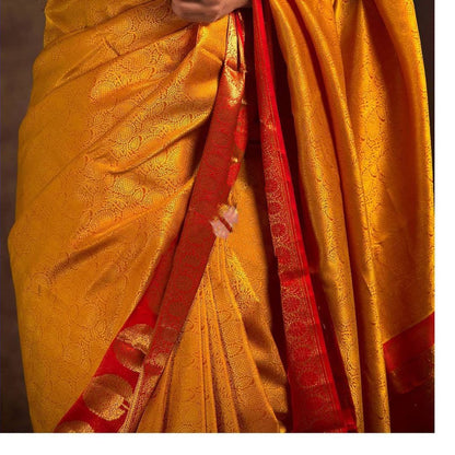 Traditional Indian Beauty: Mustard Yellow Kanjeevaram Saree with Elegant Gold Detailing