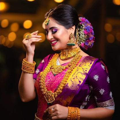 Traditional Pink Kanjivaram Saree with Purple Blouse Piece and Matching Border