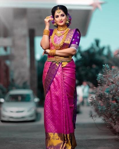 Traditional Pink Kanjivaram Saree with Purple Blouse Piece and Matching Border