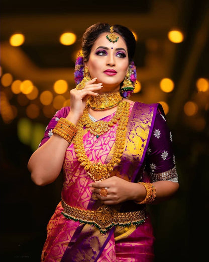 Traditional Pink Kanjivaram Saree with Purple Blouse Piece and Matching Border