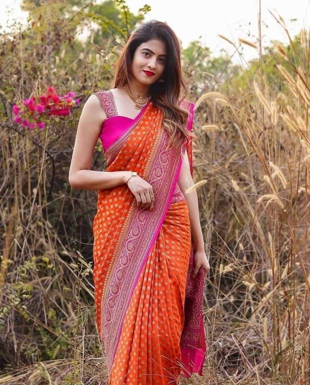 Luxurious Orange Kanjivaram Saree with Matching Border and Intricate Butti Design