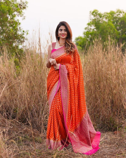 Luxurious Orange Kanjivaram Saree with Matching Border and Intricate Butti Design