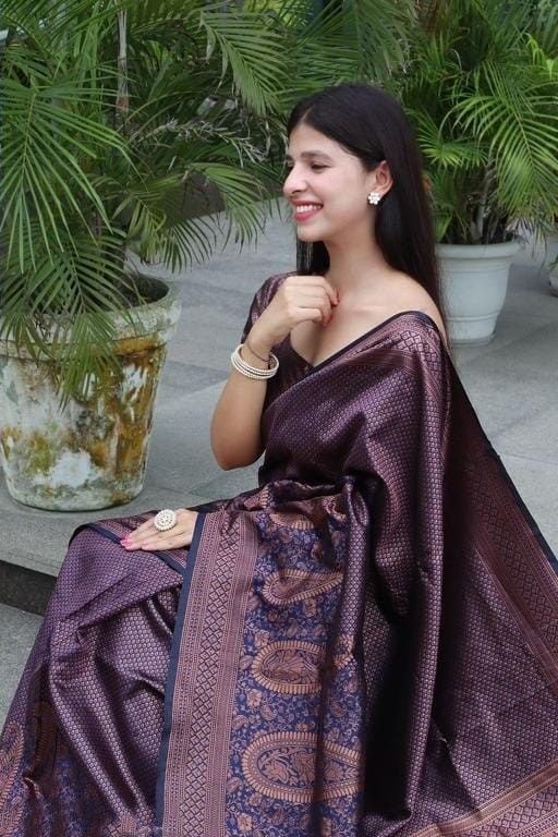 Outdoor Glamour: Woman in a Woven Purple-Brown Saree with Gold Detailing