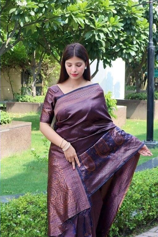 Outdoor Glamour: Woman in a Woven Purple-Brown Saree with Gold Detailing