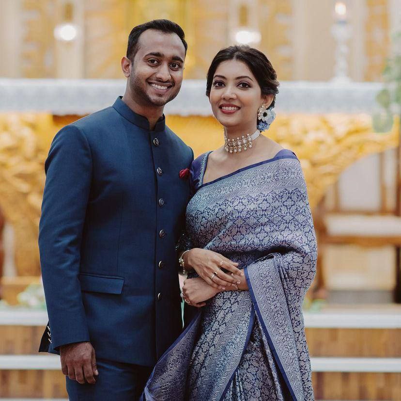 Graceful Elegance: Woman in Blue Silk Saree with Silver Detailing