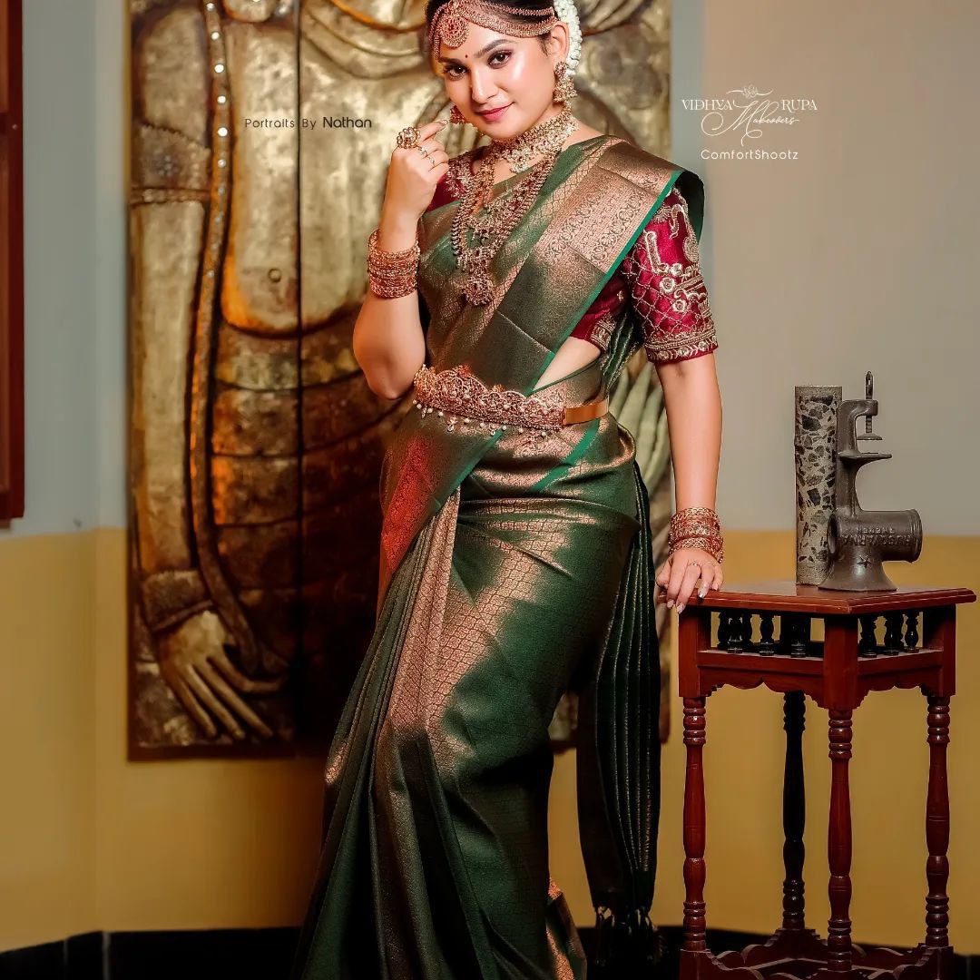 Your Perfect Celebration Look: Green Kanjivaram Saree with Golden Accents