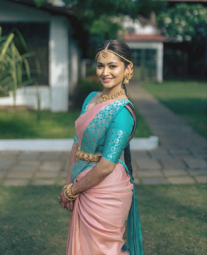 Graceful South Indian Bride in Luxurious Pastel Pink and Teal Silk Saree