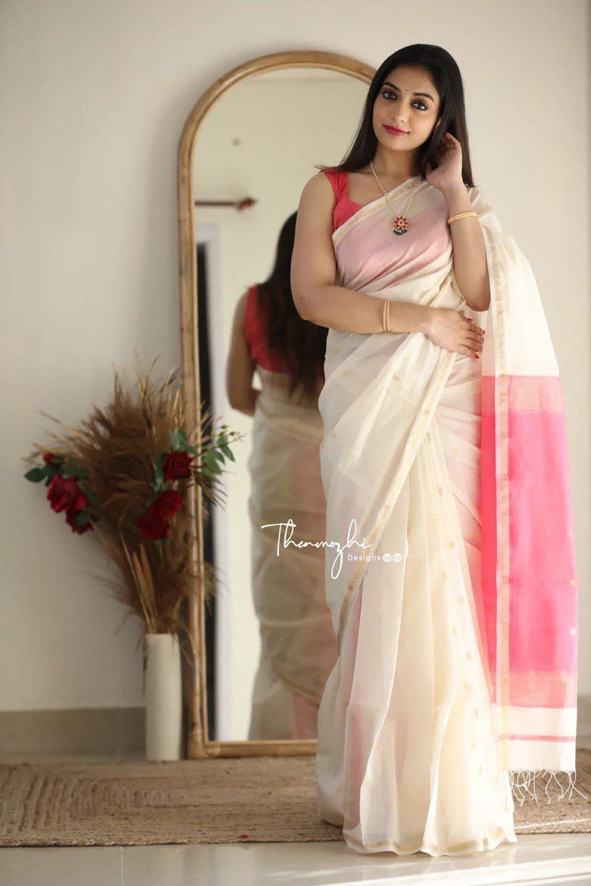 Timeless White Cotton Saree Featuring a Vibrant Pink Border for Every Occasion